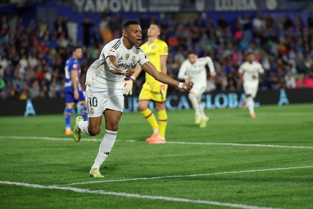 Real Madrid’s French forward Kylian Mbappe celebrates scoring his team’s first goal during the Spanish league football match between Getafe and Real Madrid at Coliseum Alfonso Perez Stadium in Getafe on Sunday. (AFP)