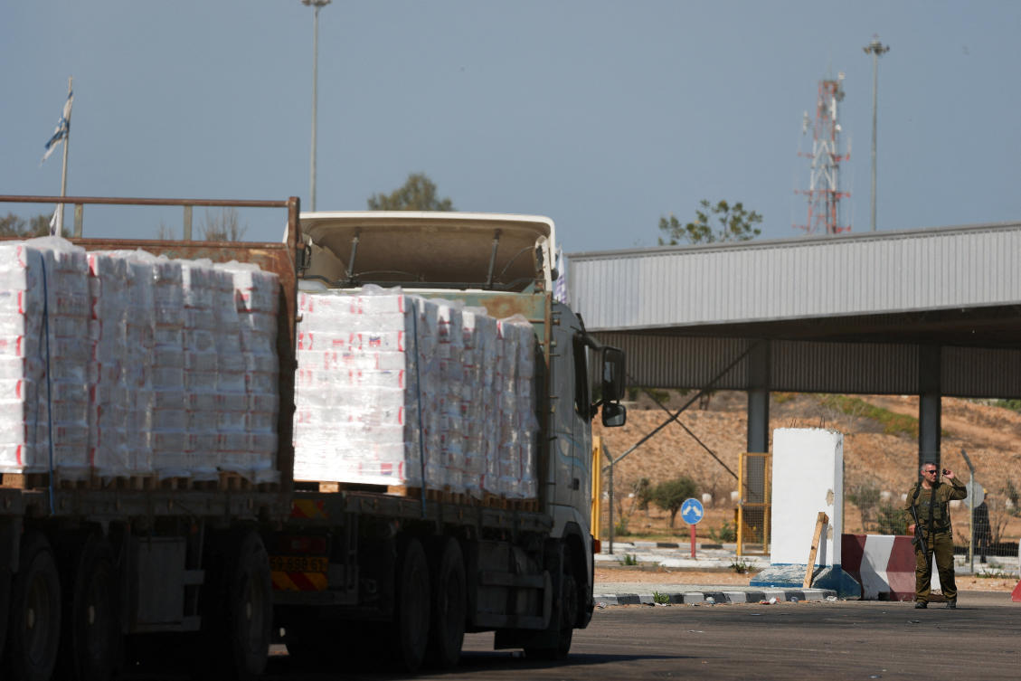 A truck carrying aid waits at the Israeli side of the Kerem Shalom border crossing to southern Gaza on Oct. 20, 2025. (Reuters)