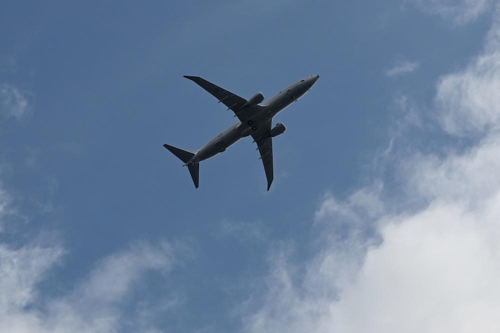 Above, a Royal Australian Navy P-8 Poseidon flies near Scarborough Shoal of the South China Sea on Sept. 3, 2025. (AFP)