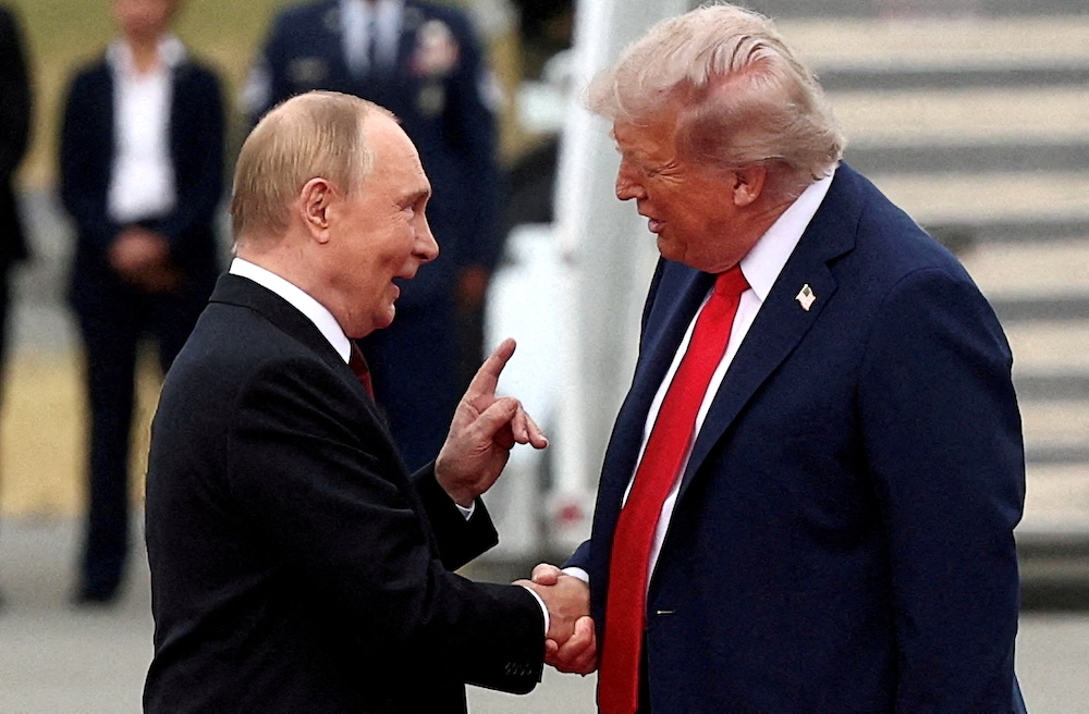 US President Donald Trump shakes hand with Russian President Vladimir Putin as they meet at Joint Base Elmendorf-Richardson in Anchorage, Alaska on Aug. 15, 2025. (Reuters)