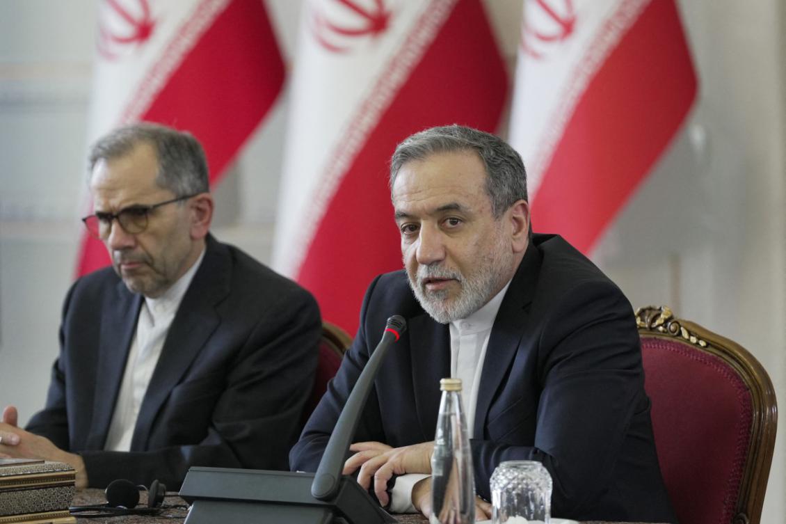 This handout picture provided by Iran's Ministry of Foreign Affairs shows Foreign Minister Abbas Araghchi (R) meeting with ambassadors and diplomatic representatives in Tehran on July 12, 2025.(File/AFP)