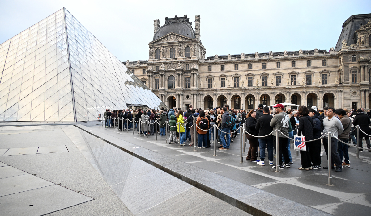 People queue as the opening of the Louvre museum that remains closed for the day after Sunday's jewels robbery, Monday, Oct. 20, 2025 in Paris. (AP)