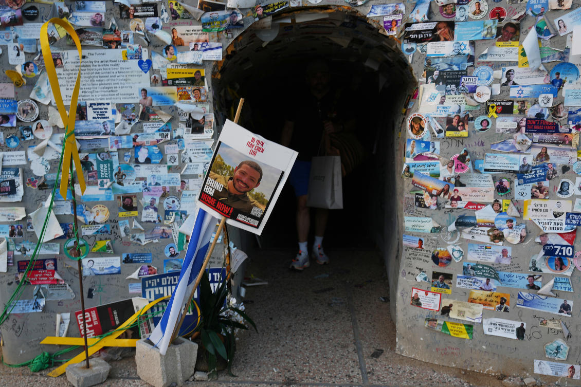 Above, a man visits an installation simulating a tunnel in Gaza in an act of solidarity with hostages at a plaza known as Hostages Square in Tel Aviv on Oct. 20, 2025. (AP)