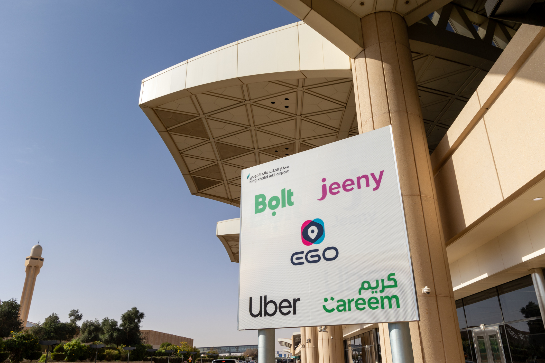 Bolt, Jeeny, EGO, Uber, Careem ride share vehicle pickup area in King Khalid International Airport in Riyadh, Saudi Arabia. Getty