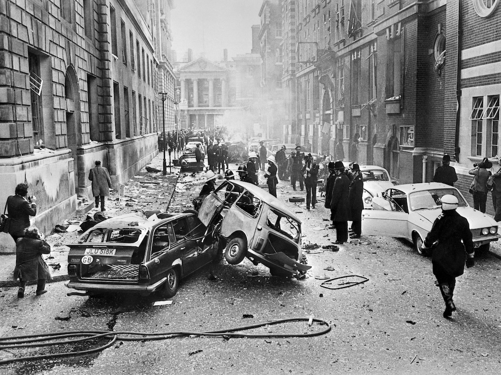 Above, destruction on a street near Whitehall after an IRA car bomb exploded on March 8, 1973 in London. (CENTRAL PRESS/AFP file photo)