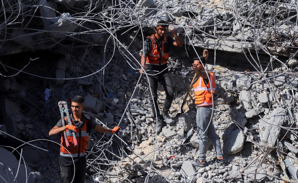 Members of the Palestinian Civil Defense search for bodies trapped under the rubble of destroyed buildings in Gaza City, Oct. 20, 2025. (Reuters)