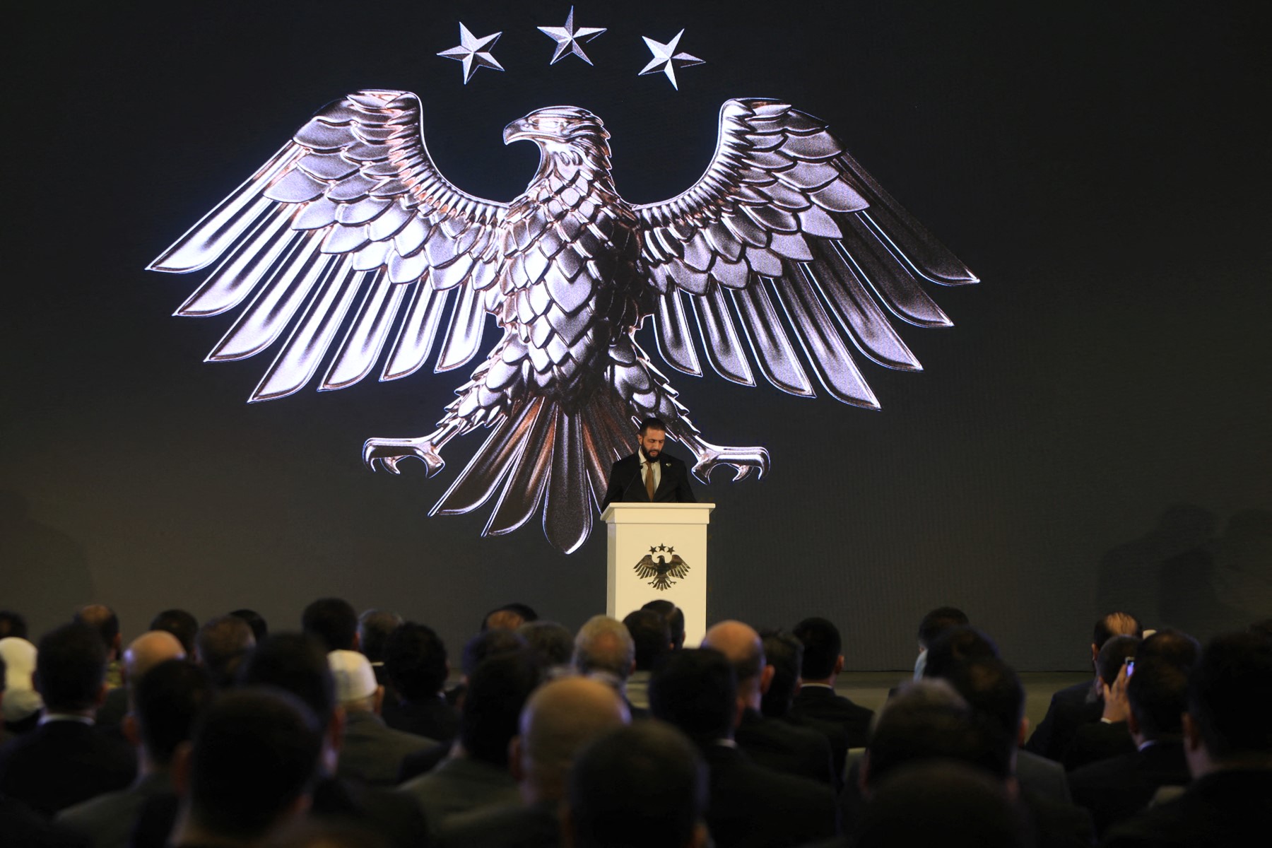 Syria’s interim President Ahmad Al-Sharaa delivers a speech during the unveiling of the country’s new national emblem at the presidential palace in Damascus, July 3, 2025. (AFP)