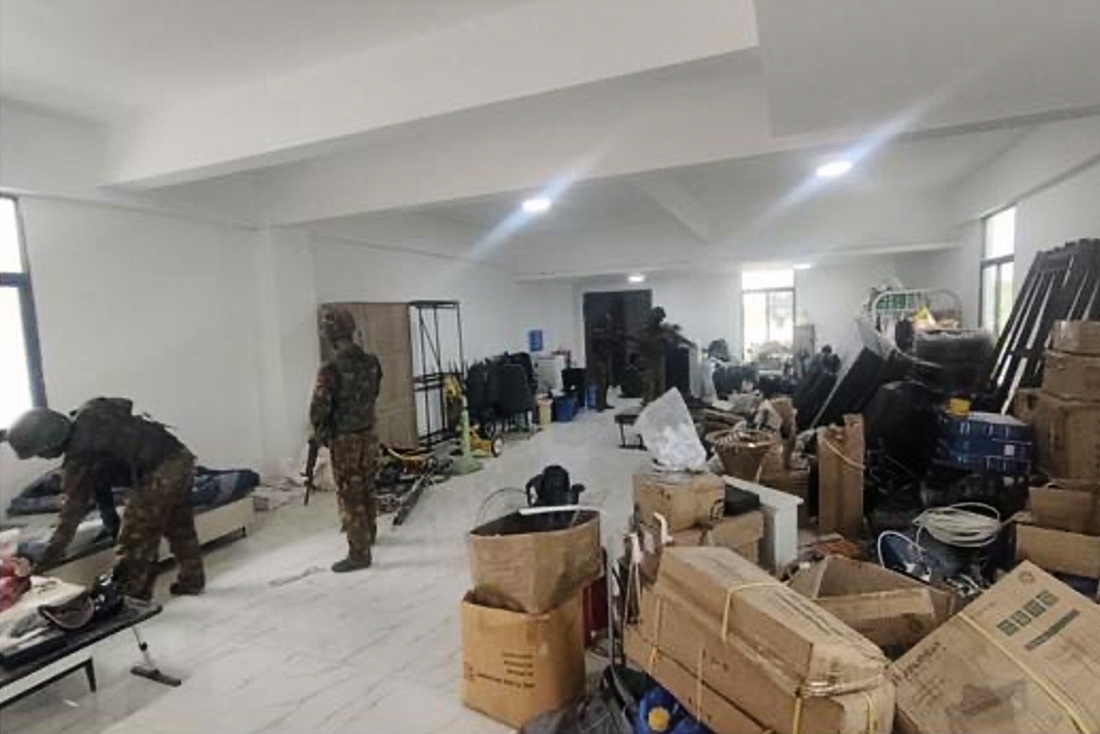 In this image provided by the Myanmar military shows soldiers raiding the KK Park online scam center in Myawaddy township, Karen State, Myanmar.