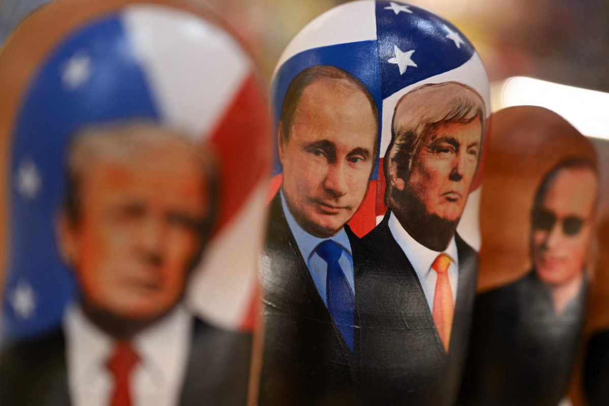 Traditional Russian wooden nesting dolls, Matryoshka dolls, depicting Russian President Vladimir Putin and US President Donald Trump are displayed for sale at a gift shop on the touristic Arbat street in downtown Moscow on October 21, 2025. (AFP)