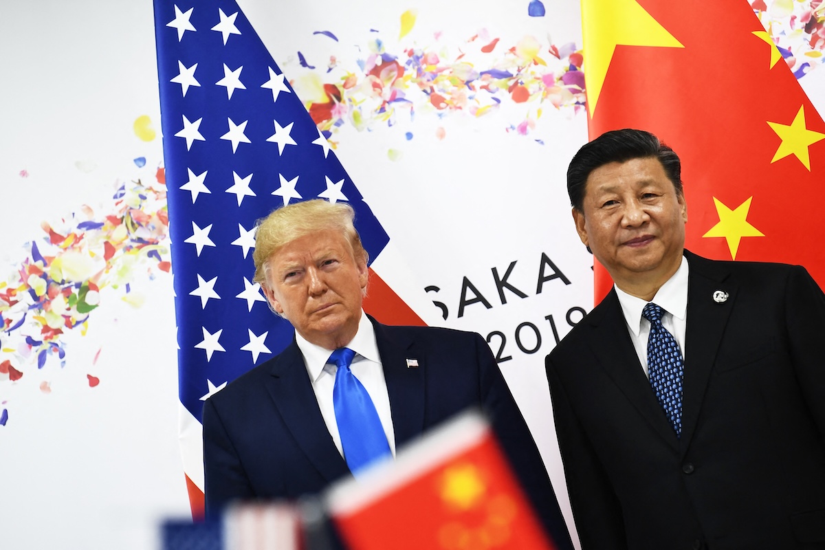 Chinese President Xi Jinping (R) and US President Donald Trump attend their bilateral meeting on the sidelines of the G20 Summit in Osaka on June 29, 2019. (FILE/AFP)