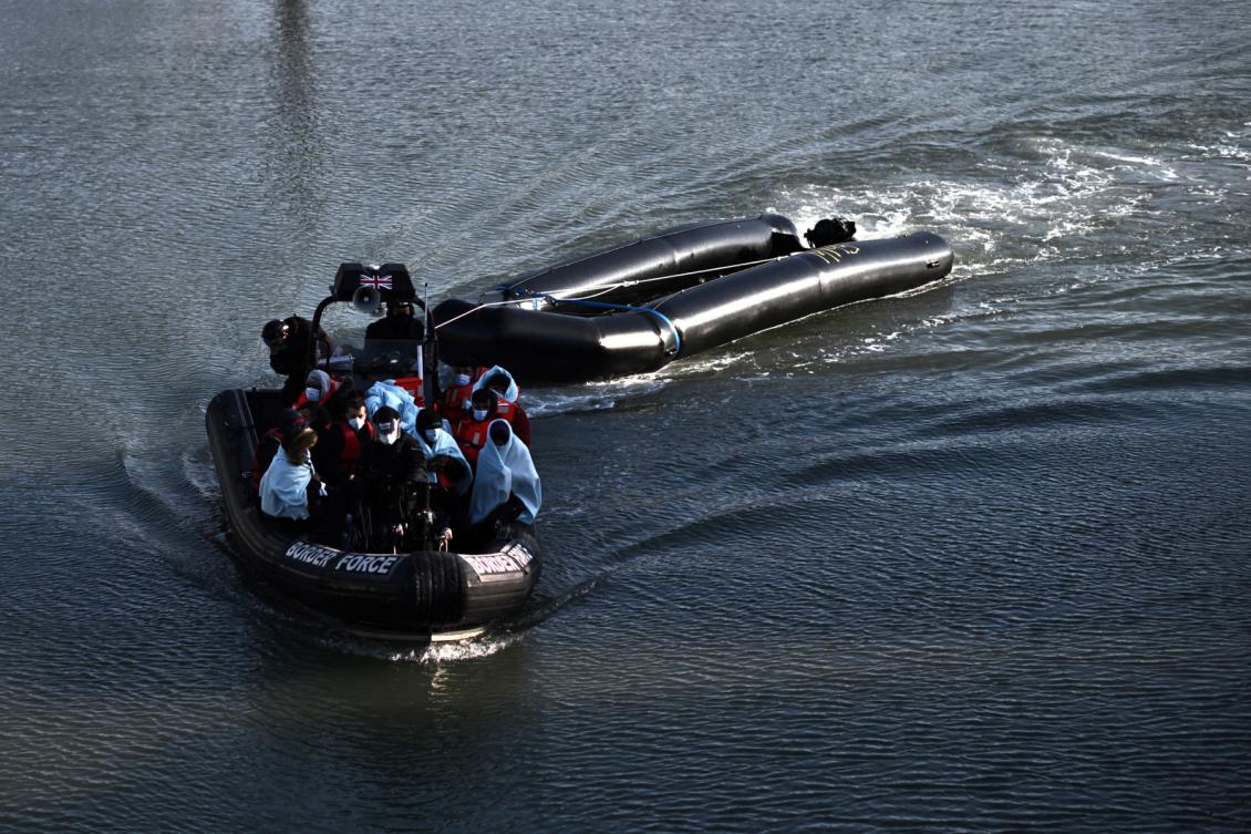 Migrants picked up at sea while attempting to cross the English Channel, are pictured on a UK Border Force boat entering the Marina in Dover, on April 18, 2022, in Dover, on the south-east coast of England.(FILE/AFP)