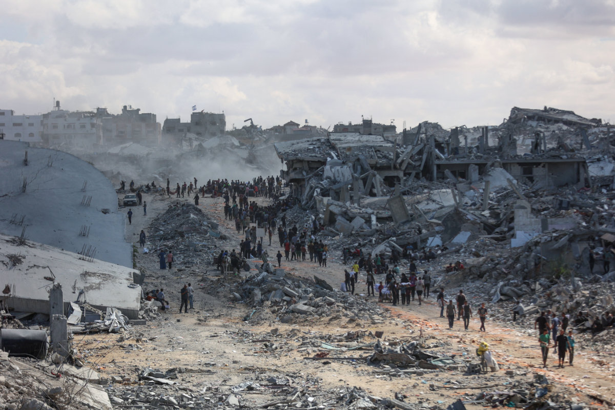 Palestinians search the rubble of buildings amid widespread destruction due to Israeli bombardment in Khan Yunis in the southern Gaza Strip, as a ceasefire holds on October 12, 2025. (AFP)