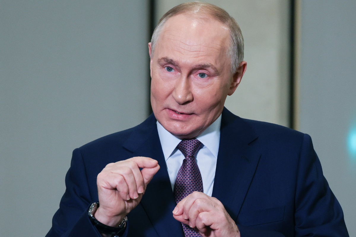 Russian President Vladimir Putin gestures while speaking to journalists on the sidelines of the Russian Geographical Society congress at the State Kremlin Palace in Moscow on Oct. 23, 2025. (Sputnik, Kremlin Pool Photo via AP)