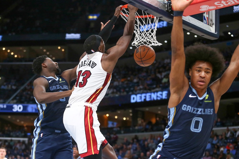 Miami Heat center Bam Adebayo dunks over Memphis Grizzlies’ Jaren Jackson Jr. (8) during the second quarter of an NBA game at FedExForum Friday. (Imagn Images)