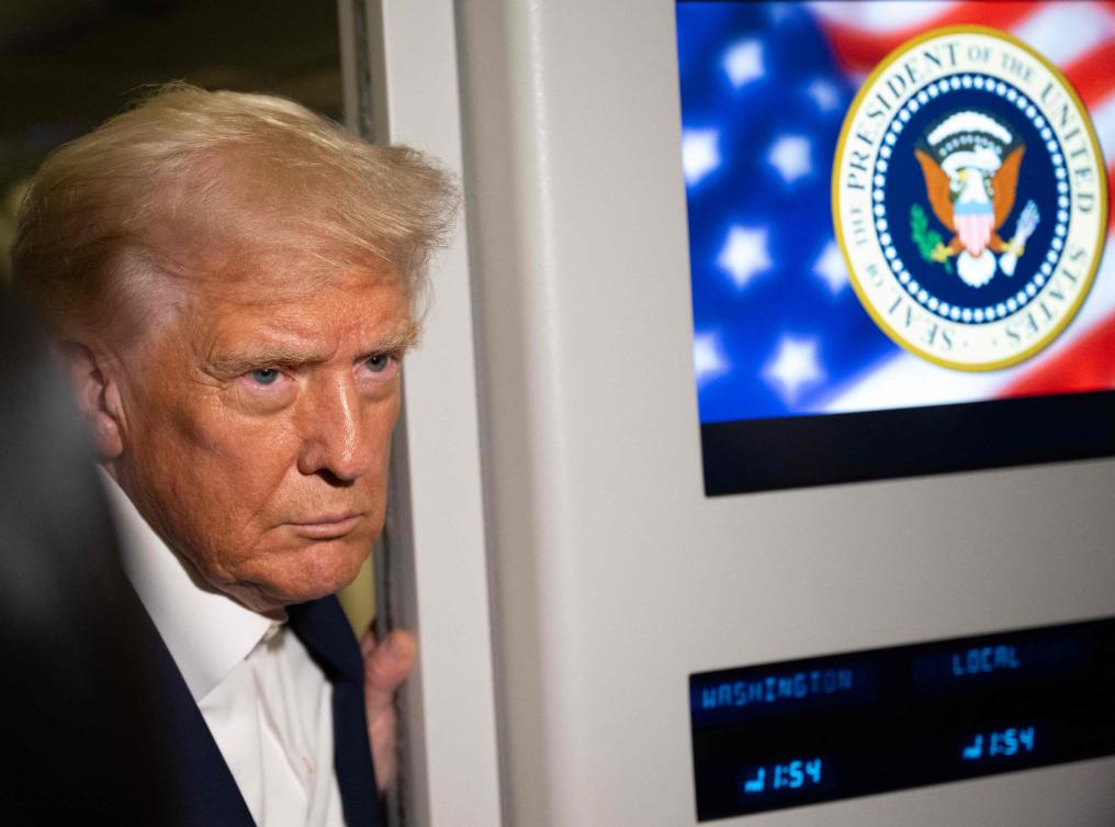 US President Donald Trump speaks to the media aboard Air Force One on Oct. 24, 2025, on the way to Malaysia for the ASEAN summit. (AFP)