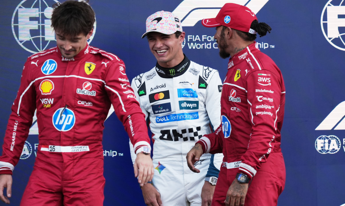 McLaren driver Lando Norris, center, the pole position winner and Ferrari drivers Charles Leclerc, left, who qualified second, and Lewis Hamilton, who qualified third, at the podium during the qualifying session for Formula One Mexico Grand Prix auto race on Saturday. (AP)