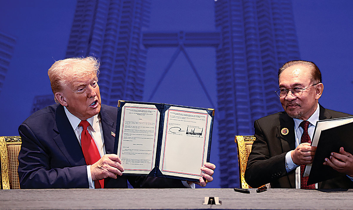 President Donald Trump and Malaysian Prime Minister Anwar Ibrahim during the 47th ASEAN summit in Kuala Lumpur on Sunday. (Reuters)
