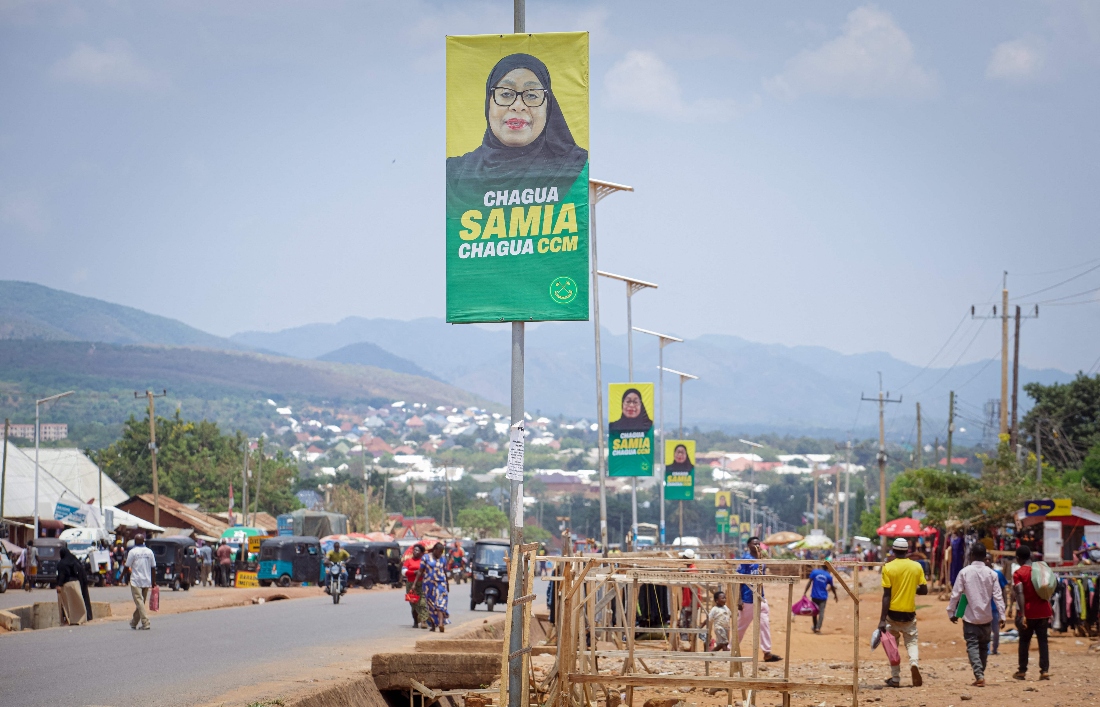 A general view of campaign posters of ruling Tanzanian Chama Cha Mapinduzi (CCM - Revolutionary Party) of the incumbent President Samia Suluhu Hassan in Kigoma town. (AFP)