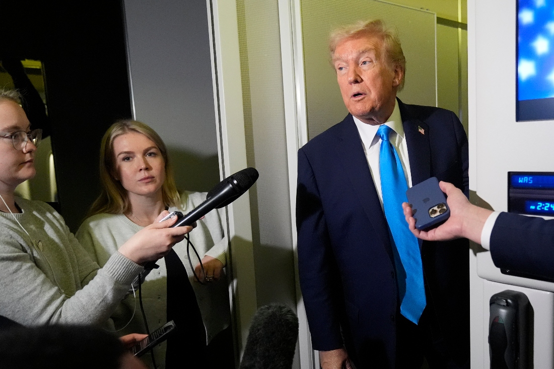 President Donald Trump speaks with reporters aboard Air Force One in Doha, Qatar. (AP)