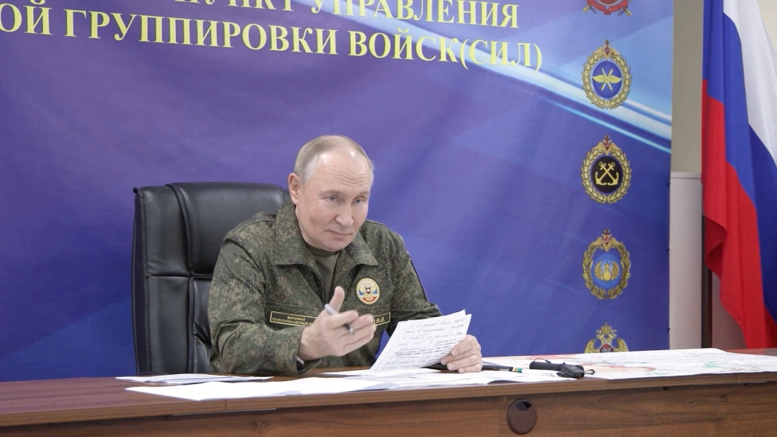 Russian President Vladimir Putin speaks, as he visits the army command centre in the course of the Russia-Ukraine conflict, in an unidentified location. (Provided by third party/Reuters)