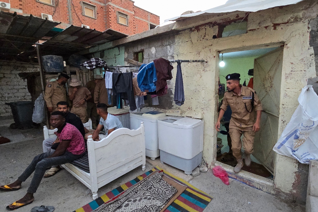 Members of Libya's Anti-Illegal Immigration Agency conduct a raid in an unregistered migrant housing unit in Tripoli, Libya. (AFP)