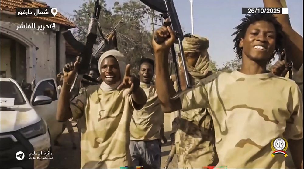 An image grab taken from video footage released on RSF’s Telegram account, Oct. 26, 2025, shows RSF fighters holding weapons and celebrating in the streets of El-Fasher in Sudan’s Darfur. (AFP)