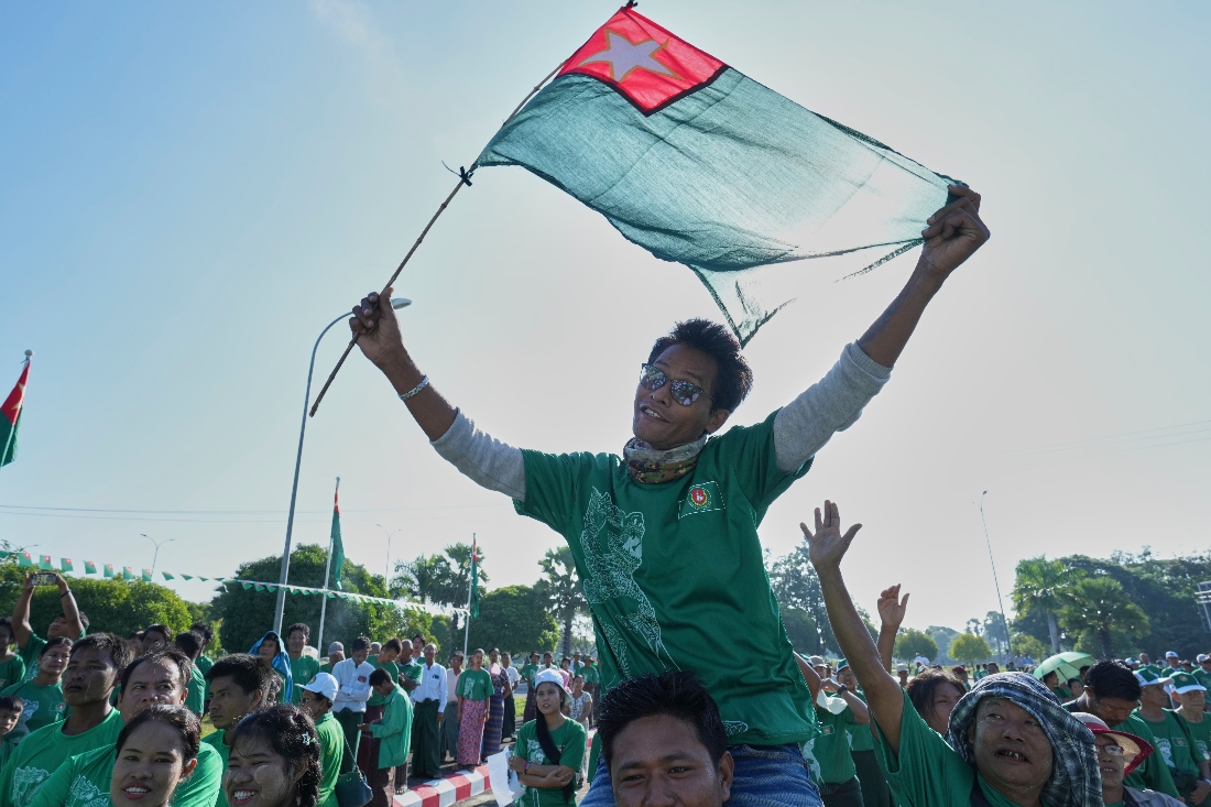 Supporters of the military-backed Union Solidarity and Development Party (USDP) wave the party flags during the first day of campaign for the upcoming general election, in Naypyitaw, Myanmar. (AP)