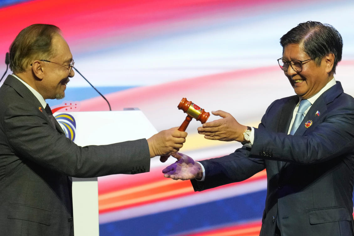 Malaysia’s Prime Minister Anwar Ibrahim, left, hands over the gavel to Philippine President Ferdinand Marcos Jr. during a transfer of ASEAN Chairmanship at the closing ceremony of the 47th Association of Southeast Asian Nations summit in Kuala Lumpur on Oct. 28, 2025. (AP)