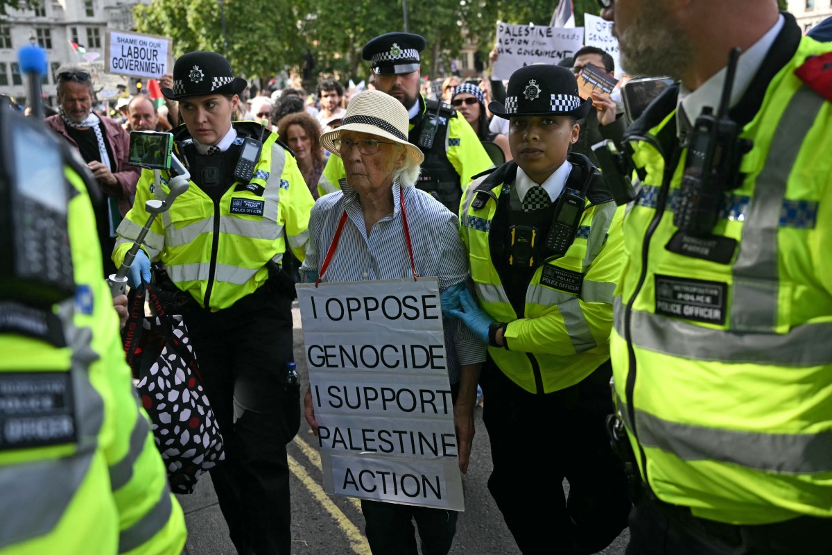 An elderly protester is taken away by police officers at a “Lift The Ban” demonstration in support of the proscribed group Palestine Action, calling for the recently imposed ban to be lifted, in Parliament Square, central London, Sept. 6, 2025. (AFP)