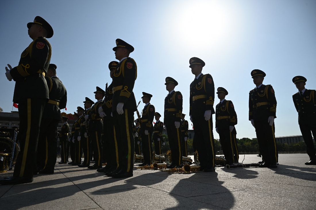 Members of a military band prepare before a wreath laying ceremony to honour deceased national heroes on Martyrs’ Day in Beijing’s Tiananmen Square, China. (AFP)