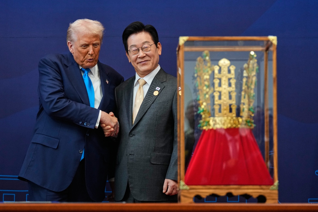 President Donald Trump shakes hands with South Korean President Lee Jae Myung as he receives a gift of a gold crown and an award of the Grand Order of Mugunghwa, during a high honor ceremony at the Gyeongju National Museum in Gyeongju, South Korea. (AP)