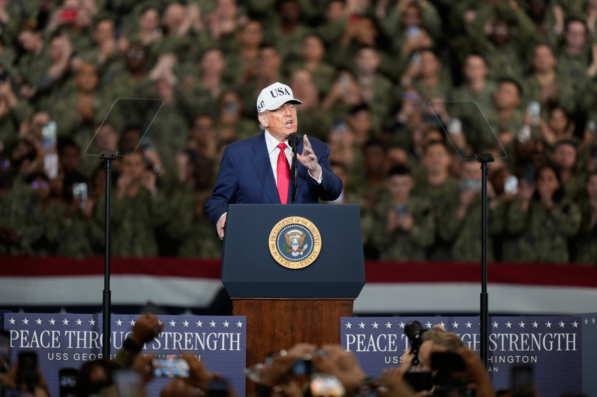 President Donald Trump delivers his speech as he meets with soldiers and servicemen at the USS George Washington at the US Navy's Yokosuka base south of Tokyo on Oct. 28, 2025. (AP Photo)