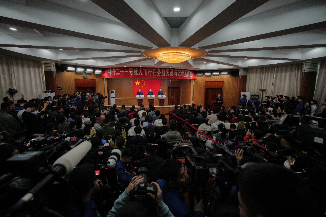 Astronauts for the upcoming Shenzhou 21 mission, from left, Zhang Hongzhang, Zhang Lu and Wu Fei attend a meeting with the press at the Jiuquan Satellite Launch Center in Jiuquan, northwest China. (AP)