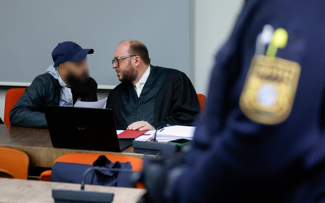 Defendant Dieter S talks with his lawyer Michael Loewe as he waits at court for his verdict in Munich, southern Germany. (AFP)