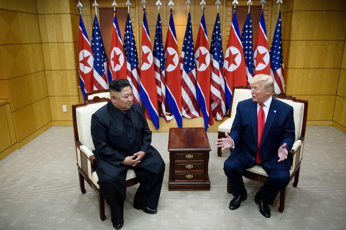 A photo dated 2019 shows North Korea's leader Kim Jong-un sits beside US President Donald Trump before a meeting in the Demilitarized Zone (DMZ), in Panmunjom, Korea. (AFP)