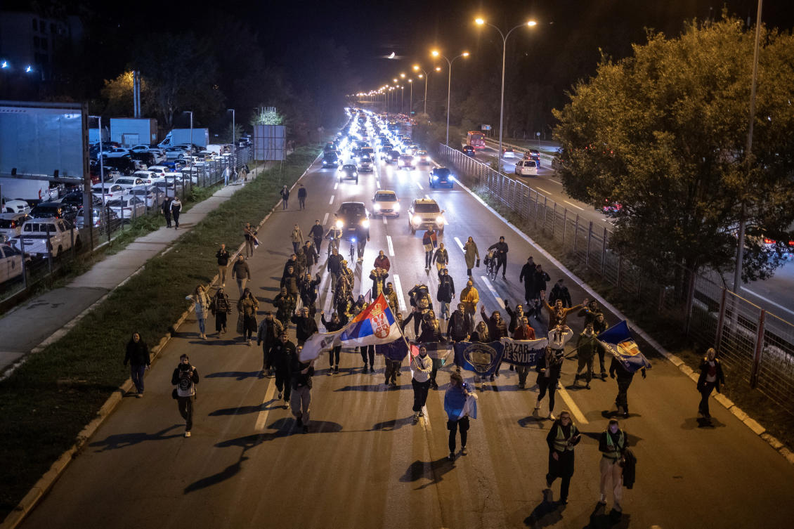 Students wave flags during a protest march over the fatal November 2024 Novi Sad railway station canopy collapse on Oct. 28, 2025. (Reuters)
