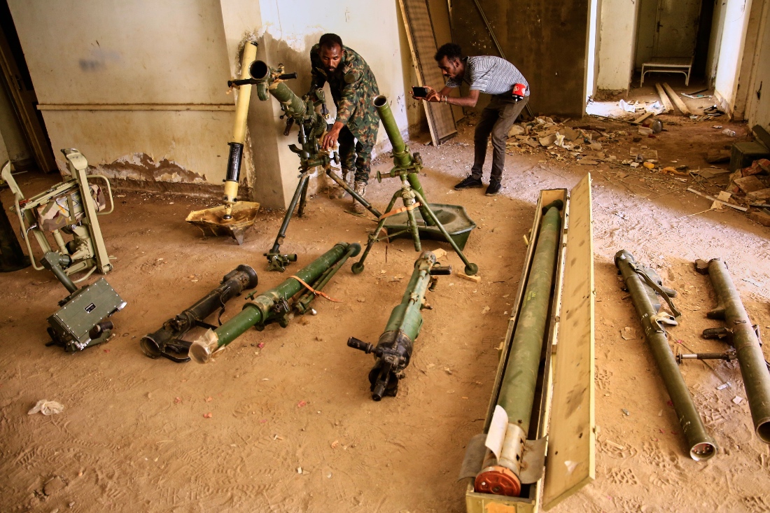 Sudanese army officers inspect a recently discovered weapons storage site belonging to the paramilitary Rapid Support Forces (RSF) in Khartoum, Sudan. (AP)