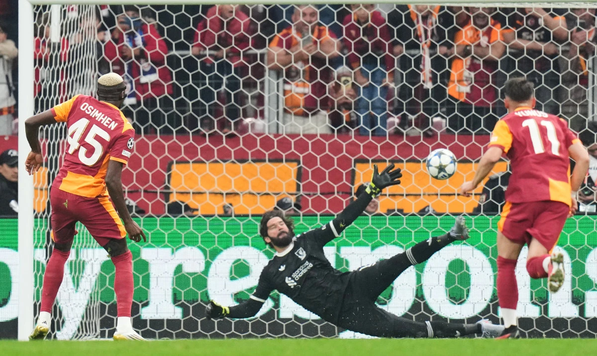 Galatasaray’s Victor Osimhen shoots a penalty kick to score a goal during the Champions League opening phase football match between Galatasaray and Liverpool at the Ali Sami Yen stadium in Istanbul Tuesday. (AP)