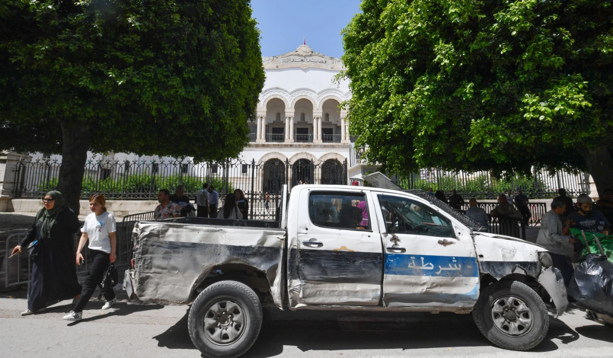 A police vahicle is parked in front of the Tunis court where Tunisian journalists Borhen Bssaies and Mourad Zeghidi are set to appear in court on May 22, 2024. (AFP)