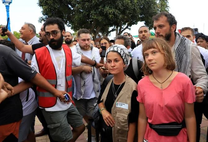 Swedish activist Greta Thunberg, right, and German activist Yasemin Acar are welcomed by Tunisian people after the Global Sumud Flotilla arrived at Sidi Bou Said, Tunisia, Sept. 7, 2025. (AP/File Photo)
