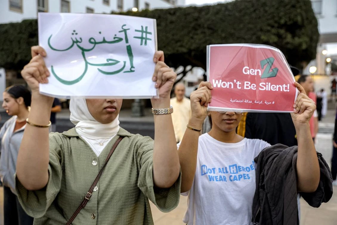 Demonstrators hold placards during a protest called for by the self-styled "GenZ212" collective demanding reforms to public healthcare and education in Rabat for the eighth consecutive day on October 3, 2025. (FILE/AFP)