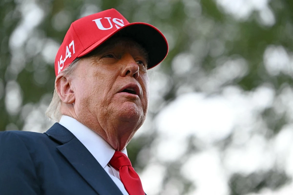 US President Donald Trump speaks to the press outside the Oval Office after landing on the South Lawn of the White House in Washington, DC, Oct. 5, 2025. (AFP)