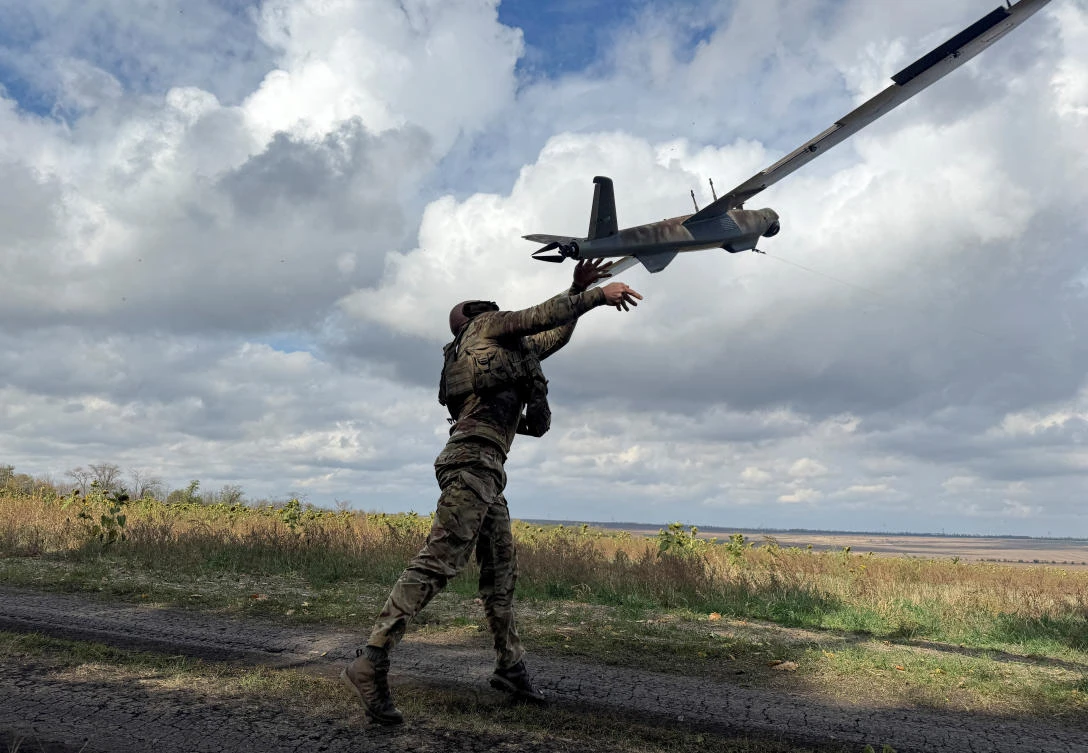Above, a Ukrainian serviceman launches a reconnaissance drone near the frontline town of Pokrovsk in Donetsk region on Oct. 6, 2025. (Reuters)