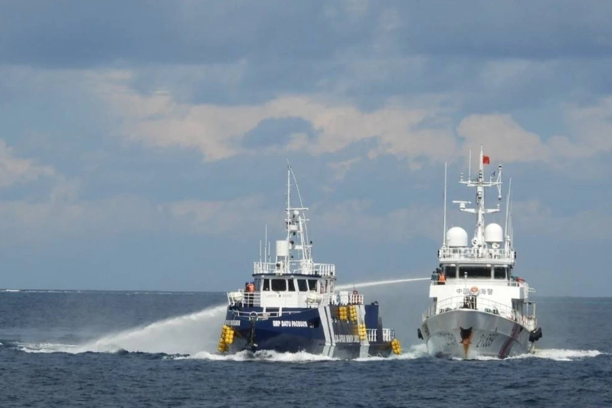Chinese coast guard rams and damages a Philippine vessel off an island in the South China Sea