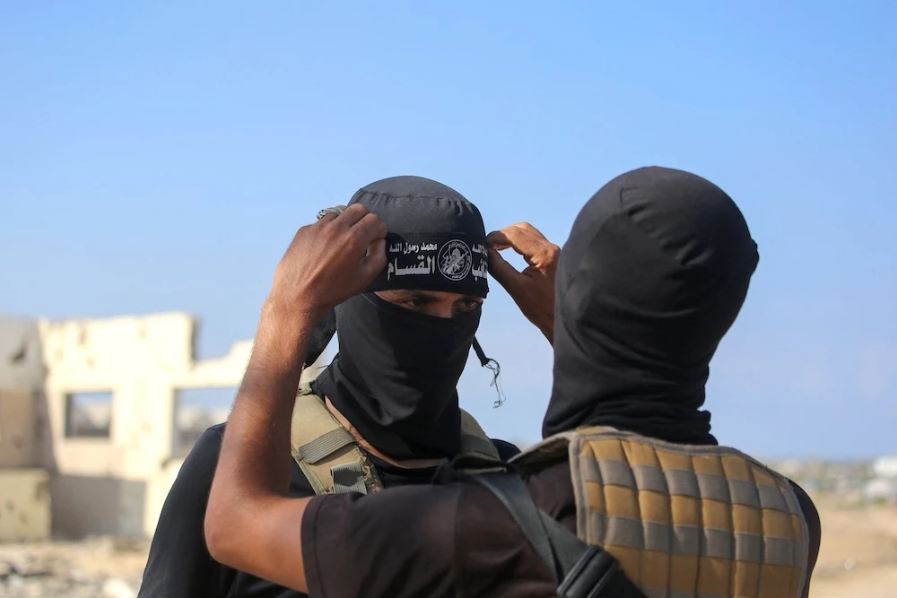 Fighters of the Ezzedine Al-Qassam Brigades, the armed wing of Hamas movement, at Deir El-Balah in the central Gaza Strip on Oct. 13, 2025. (AFP)