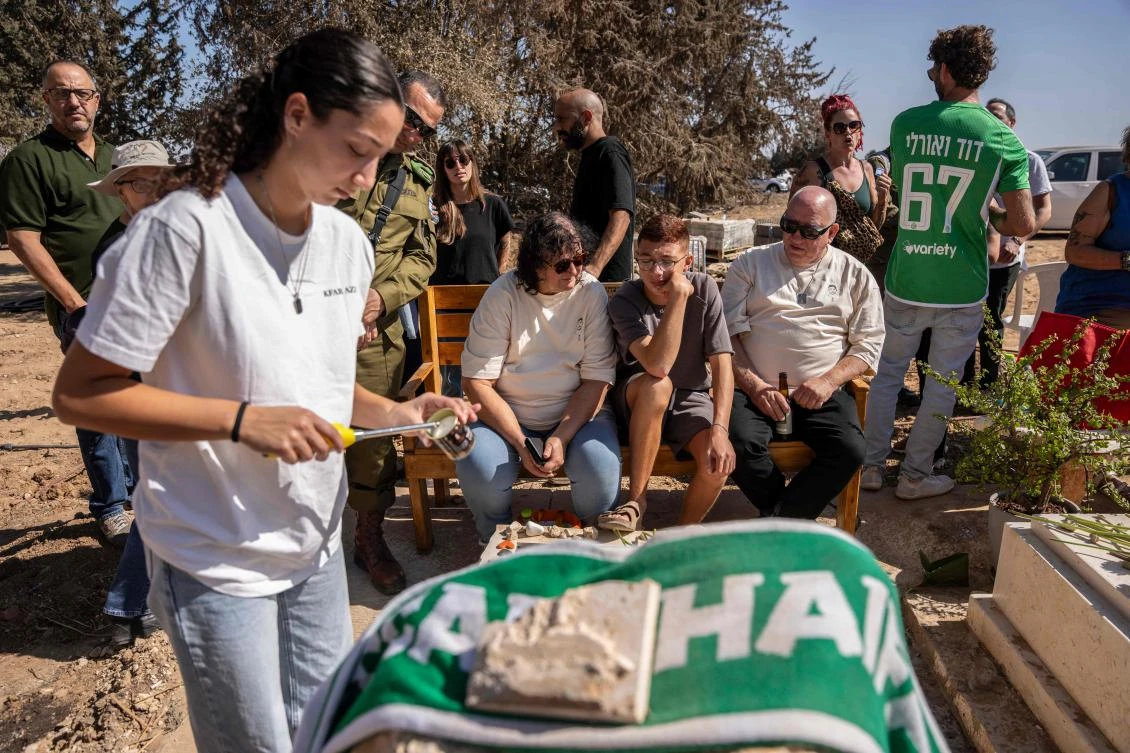Members of the Kfar Aza kibbutz hold a memorial service for those killed in Hamas’s Oct. 7, 2023 attack on Israel, in Kibbutz Kfar Aza, located in southern Israel near the Gaza border, on Oct. 16, 2025. (AFP)