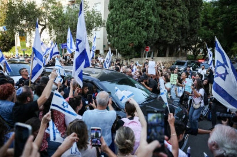 Friends and family welcome back to his family home former Israeli hostage Eitan Horn, after leaving hospital following his release from captivity in Gaza, in Kfar Saba, Israel, Oct. 16, 2025. (Reuters)