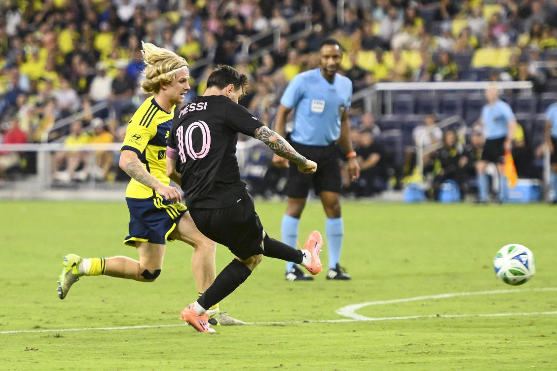 Oct 18, 2025; Nashville, Tennessee, USA; Inter Miami forward Lionel Messi (10) takes a shot on goal against Nashville SC during the second half at Geodis Park. Mandatory Credit: Steve Roberts-Imagn Images
