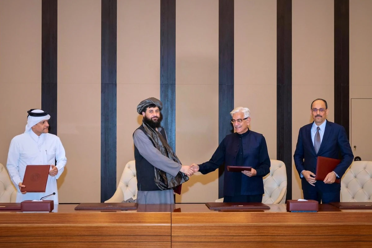 Pakistani Defense Minister Khawaja Asif, center right, and Afghan Defense Minister Mullah Muhammad Yaqoob shake hands after signing a ceasefire agreement in Doha, Qatar, Sunday, October 19, 2025. (AP)