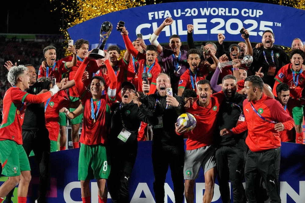 Players of Morocco celebrate with the trophy after defeating Argentina to win the FIFA U-20 World Cup final in Santiago, Chile, Sunday. (AP)